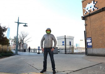 Nov 23 - NYC - World famous graffiti artist Invader posing in front of his work at Pier 40 on the Hudson River.