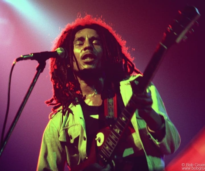 Bob Marley, the most important reggae singer in the world, looks great bathed in the yellow, red and green colors of the Rastafarian faith as he played at the Beacon Theatre.