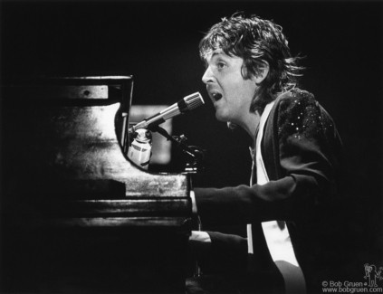 Paul McCartney with Wings on stage with piano at MSG, NYC. May 25, 1976. © Bob Gruen / www.bobgruen.com Please contact Bob Gruen's studio to purchase a print or license this photo. email: info@bobgruen.com Image #: R-68 Paul McCartney, NYC - 1976