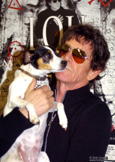 Lou Reed with his dog Lollabelle at the Sister Ray office, NYC. April 5, 2003. Image #: C-261 © Bob Gruen Lou Reed & Lollabelle, NYC - 2003