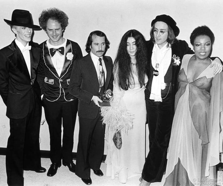 (L-R) David Bowie, Art Garfunkel, Paul Simon, Yoko Ono, John Lennon and Roberta Flack, NYC. March 1, 1975. <P>Image #: R-397  © Bob Gruen