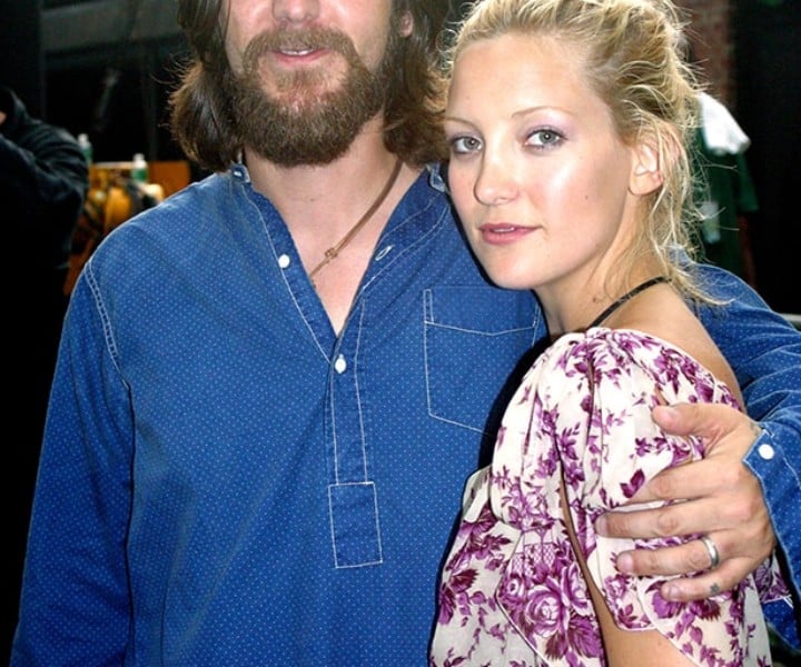 July 11 - NYC - Chris Robinson opened the show at Central Park's Summerstage July 11 and the fans cheered as he kept playing through a thunderstorm. His beautiful wife Kate Hudson was there with him, lookin' good and expecting their baby next January.