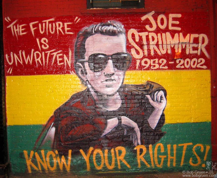 Nov 16 - NYC - This is the centerpiece of a video for Joe Strummer's version of Bob Marley's "Redemption Song" from Joe's new Mescaleros album "Streetcore". The video, directed by Josh Cheuse shows artists Dr. Revolt and Zephyr creating this mural on the wall of the Niagara Bar in the East Village, while many of Joe's well known friends and local neighbors watch. 