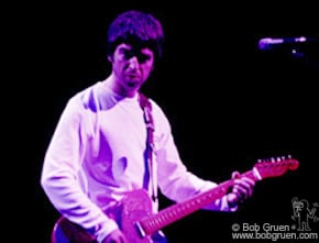 Noel Gallagher plays during Oasis set.
