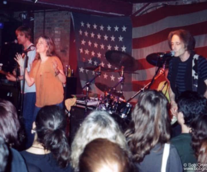 June 6 - NYC - Patti Smith Group plays at the Village Underground with an American flag background.