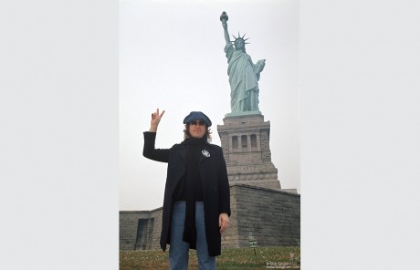 John Lennon in front of The Statue of Liberty, NYC. October 30, 1974.