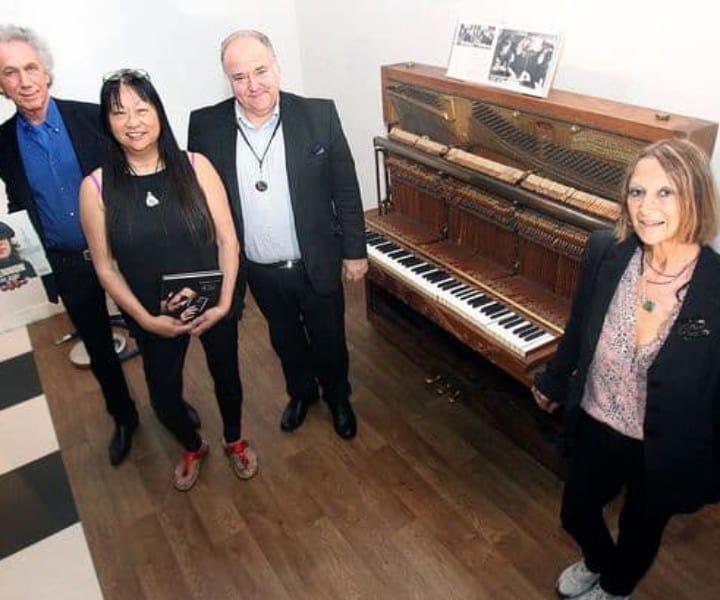 Aug 27 – Liverpool, England –  I was in Liverpool for the opening of a permanent exhibition of my photos at the Beatles Story Museum. Also unveiled was a piano used by John Lennon that had just arrived from New York. Here at the press conference I’m with May Pang, Museum director Martin King, and John Lennon’s half sister Julia Baird.