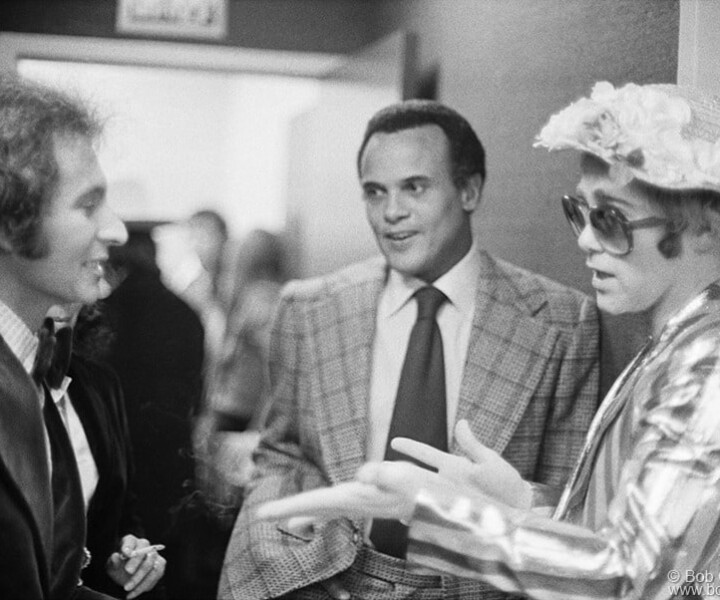 Ron Delsener, Harry Belafonte and Elton John, Carnegie Hall, NYC. November 19 or 20, 1972. <P>Image #: MCA4_11-25_1972  © Bob Gruen