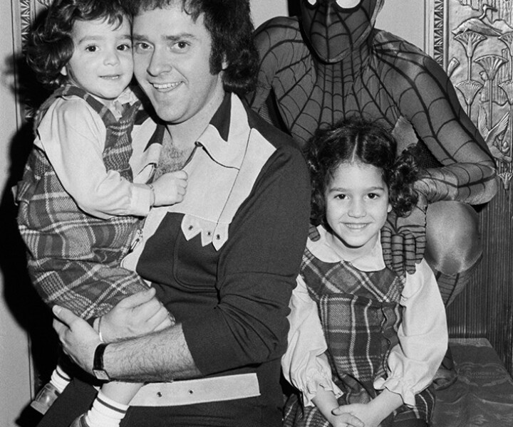 Neil Bogart, Spiderman and children, NYC. 1972. <P>Image #: BU66_5-5a_1972 © Bob Gruen