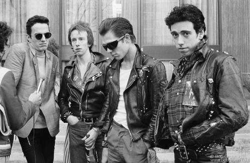 (L-R) Joe Strummer, Topper Headon, Paul Simonon and Mick Jones of the Clash being interviewed during their tour of the USA. February 1979. Image #: Clash279_7-12_1979 © Bob Gruen Clash, USA - 1979
