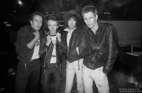(L-R) Joe Strummer, Topper Headon, Mick Jones and Paul Simonon of the Clash at the San Gennaro Festival in NYC. September 1978. Image #: Clash978_6-29a_1978 © Bob Gruen Clash, NYC - 1978