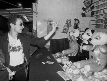 Joe Strummer of the Clash at the San Gennaro Festival in NYC. September 1978. Image #: Clash978_6-31a_1978 © Bob Gruen Joe Strummer, NYC - 1978