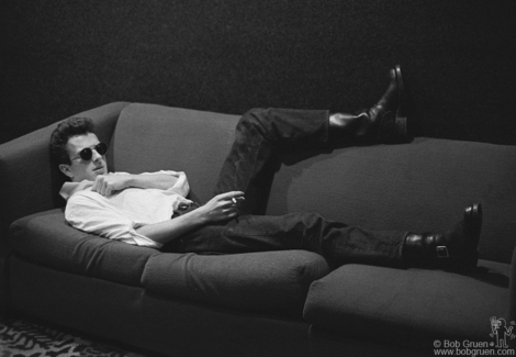 Joe Strummer of the Clash laying on a couch at the Record Plant, NYC. September 1978. Image #: Clash978_8-4a_1978 © Bob Gruen Joe Strummer, NYC - 1978