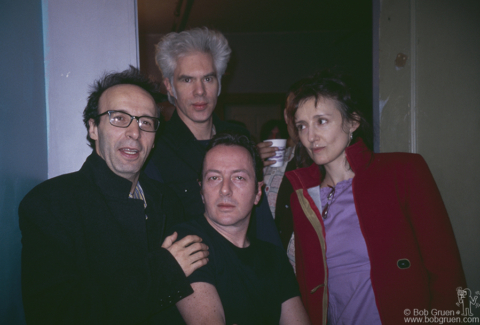 (L-R) Roberto Benigni, Jim Jarmusch, Joe Strummer of the Clash and Unknown backstage at Wembley Arena in London, England. November 15, 2000. Image #: Personal1100_2000_6 © Bob Gruen Roberto Benigni, Jim Jarmusch and Joe Strummer, London - 2000