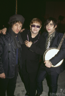 (L-R) Jesse Malin, Elton John and Ryan Adams during the filming of Ryan Adam’s music video for "Answering Bell" in NYC. January 11, 2002. Image #: RyanAdams102_2002_7_fullframe © Bob Gruen Jesse Malin, Elton John and Ryan Adams, NYC - 2002